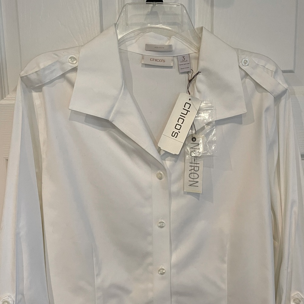 NWT Chicos white dress shirt with button details on shoulder.
